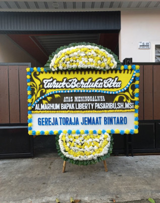 Papan Bunga Duka di Rainis